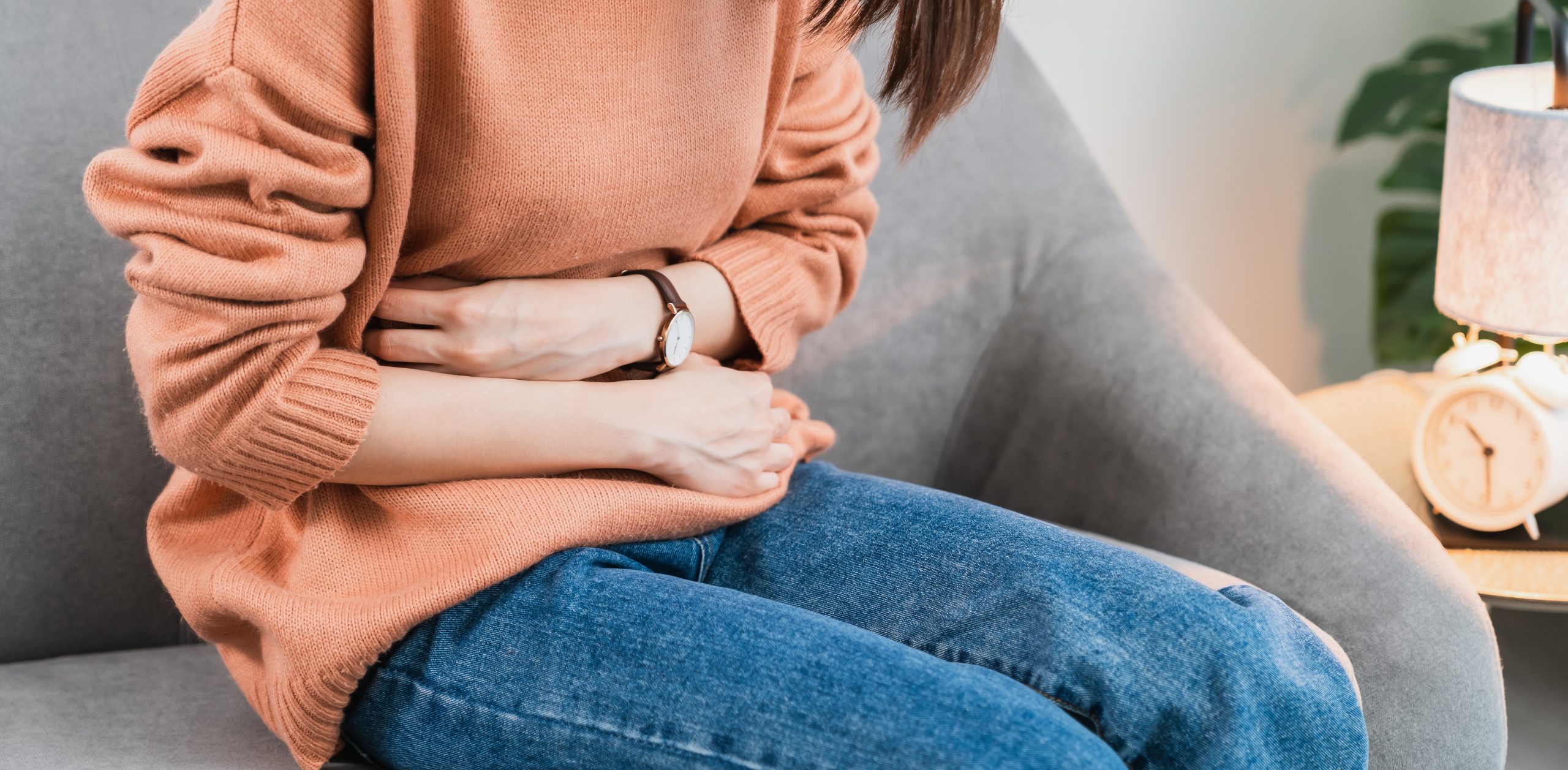 Young,Asian,Woman,Hands,Holding,The,Stomach,And,Pain,Period